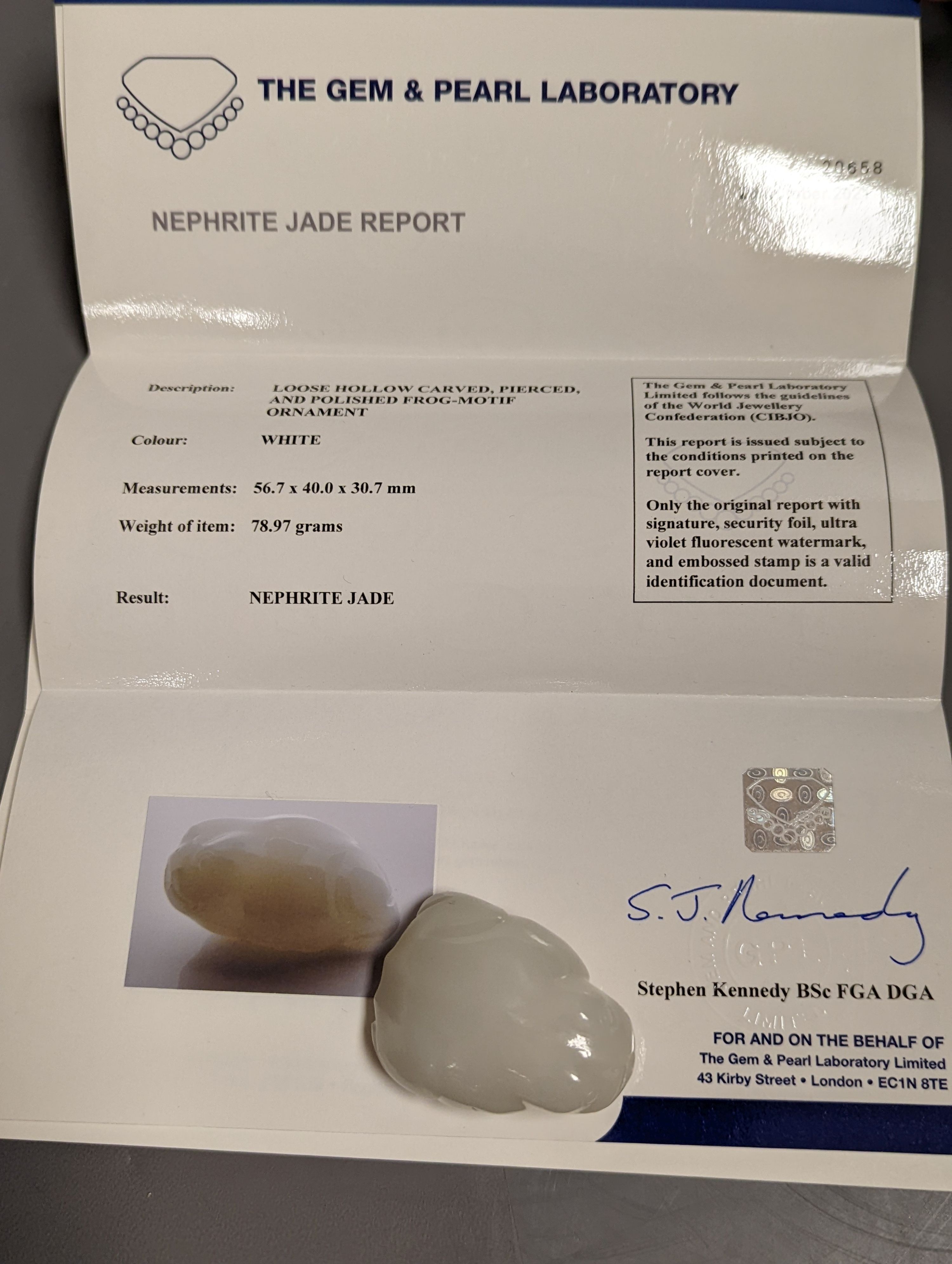 A Chinese white jade 'toad' snuff bottle, the stone of excellent even tone, 8cms long, including stopper